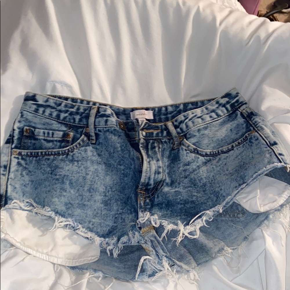 Distressed bleach washed denim booty shorts